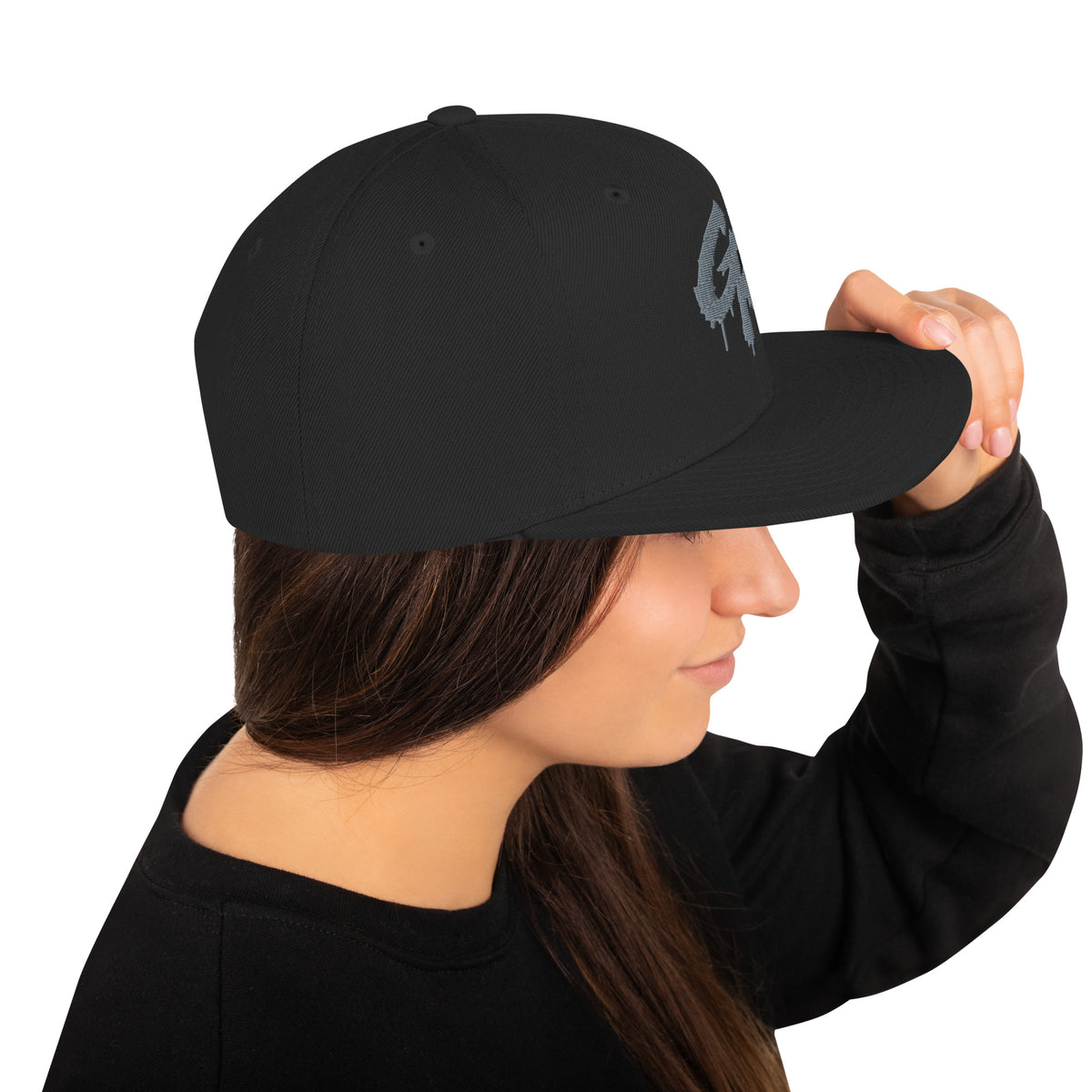 Right side of the black Concrete Fairways snapback on a model, with the flat brim and gray drip GR