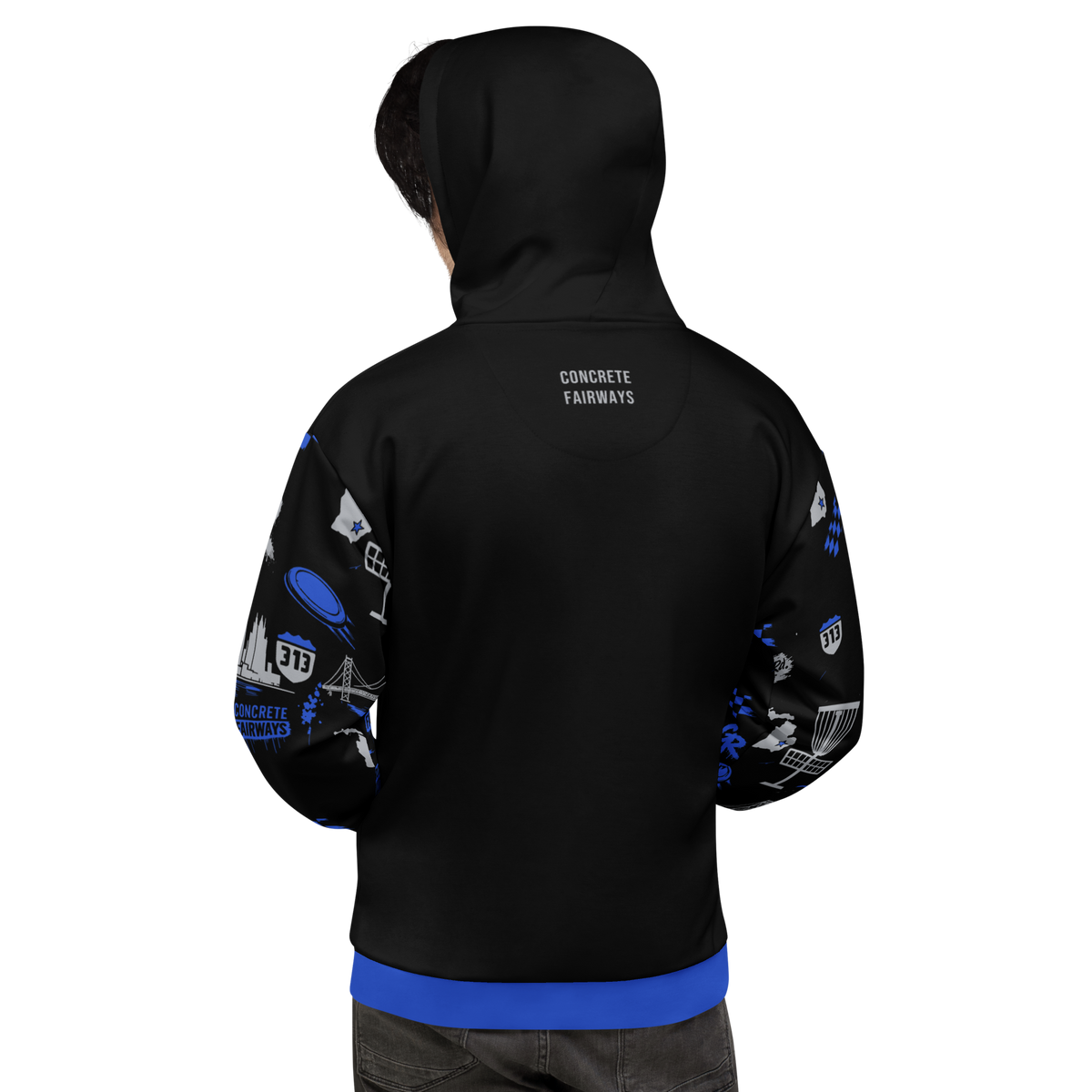 Back of model in black Concrete Fairways hoodie, hood up, small CONCRETE FAIRWAYS text, pattern sleeves, royal hem band