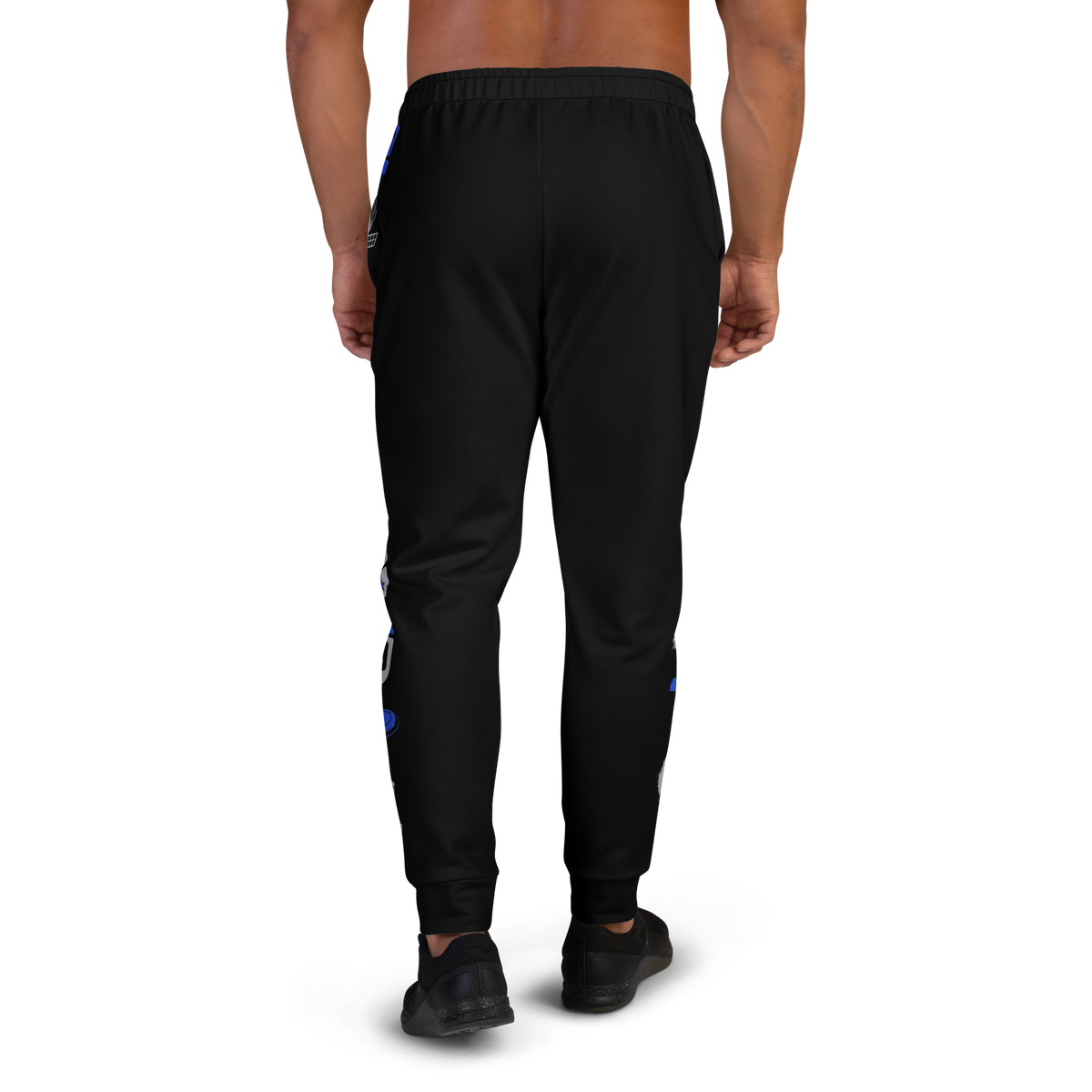 Back view of model wearing black Concrete Fairways disc golf joggers with blue pattern along the leg sides