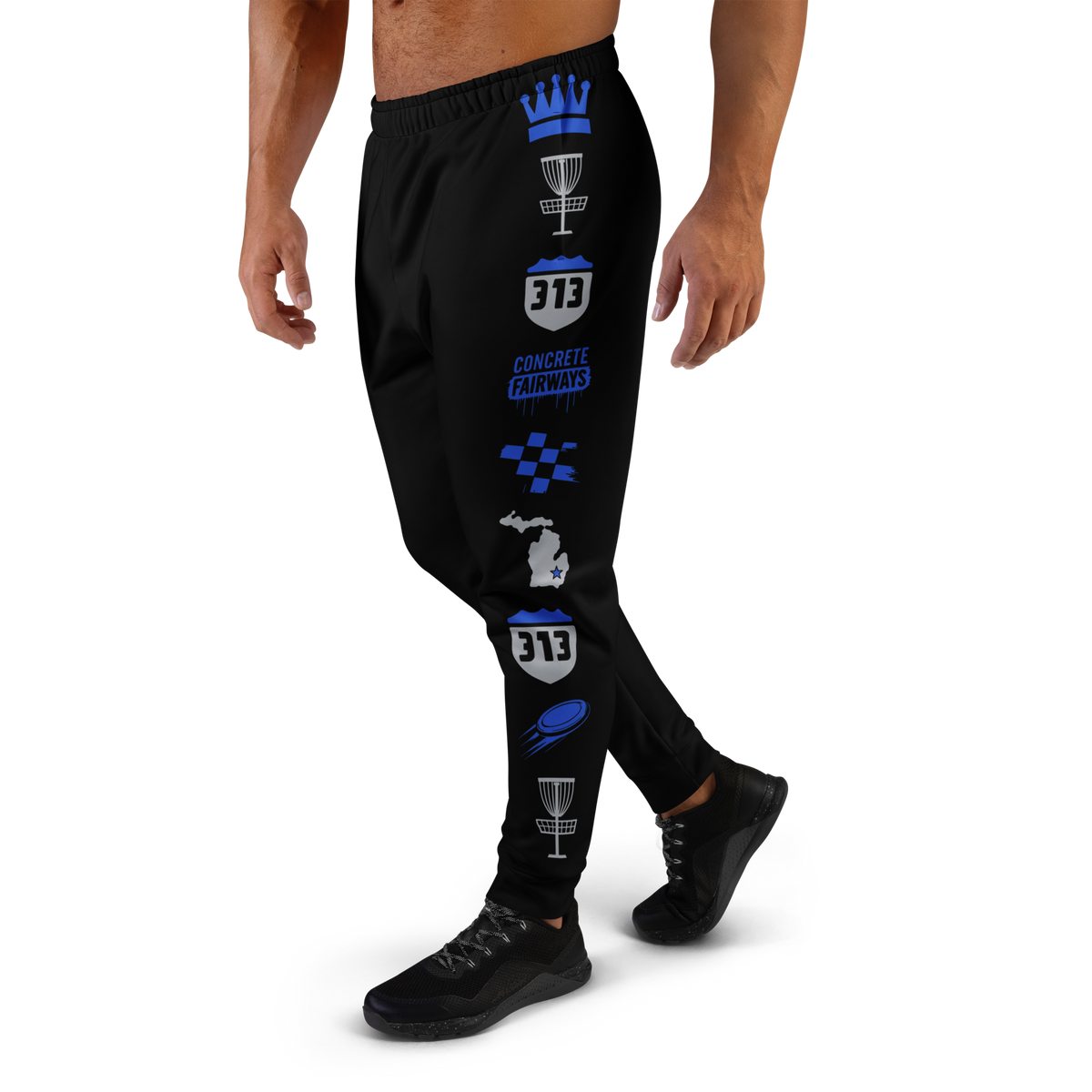 Side view of model in black Concrete Fairways joggers showing the blue crown, basket and 313 pattern down the leg