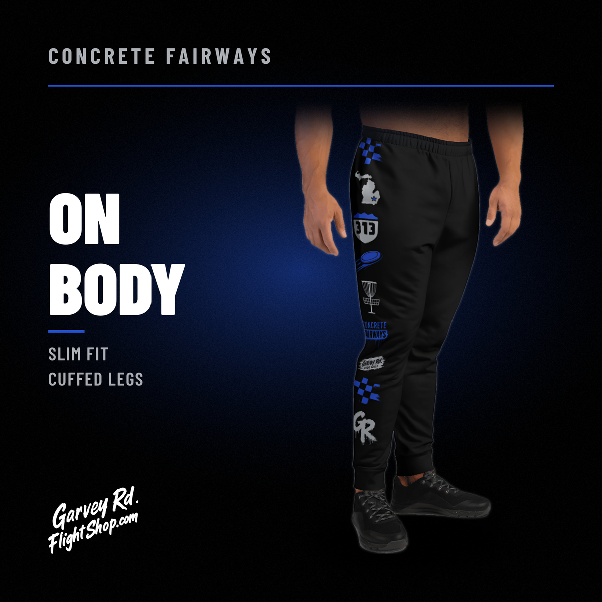 Model wearing black Concrete Fairways disc golf joggers, slim fit with cuffed legs and royal and gray leg art