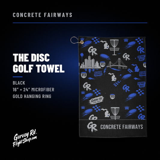 Concrete Fairways disc golf towel graphic: black 16x24 microfiber towel with royal blue Detroit art and gold hanging ring